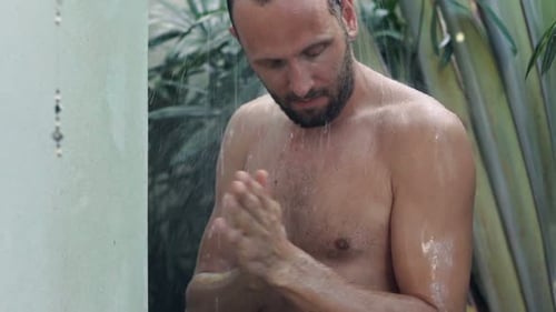Man Uses Soap While Taking Tropical Shower