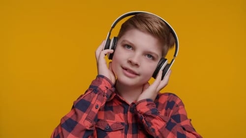 Boy Listening to Music on Headphones Close Up