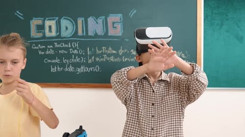 Children coding in school with virtual reality headset
