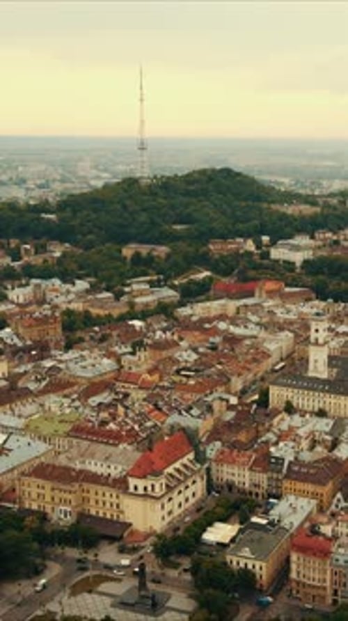 Vertical Drone aerial video in central part of old city of Lviv, Ukraine