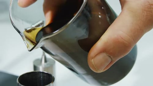 Close View Scientist Pours Crude Oil Into Metal Cylinder