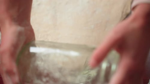 Rolling out dumpling dough by hand