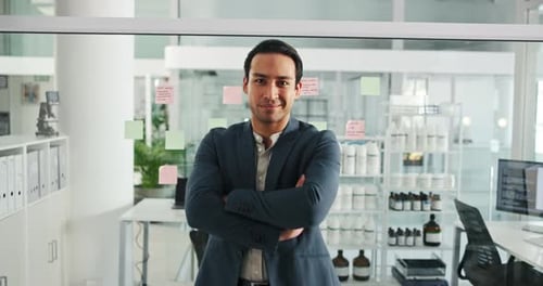 Confident Man Smiling in Modern Office Environment