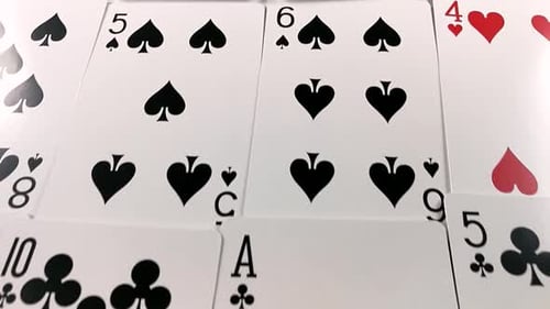 Close-Up of Playing Cards on White Surface