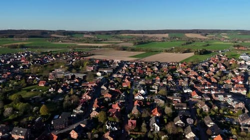 Quaint European Town and Green Farmland Aerial View