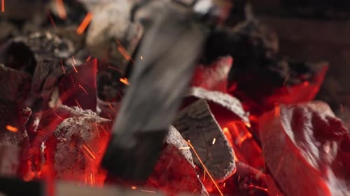 Close Up View of Burning Embers and Flames From Wood Fire