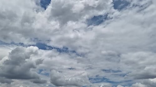 Clouds Moving Across a Blue Sky on a Sunny Day