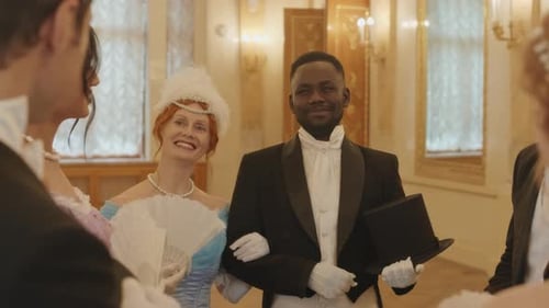 Adults Gathered in Historical Formal Wear