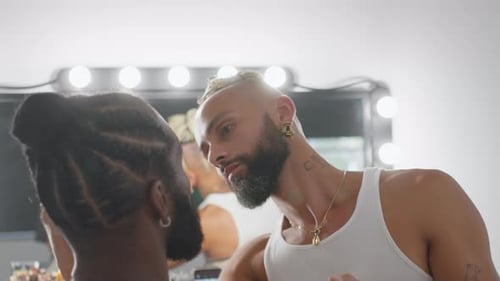 Make-up Artist Applying Makeup to Client Indoors