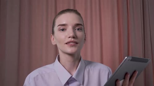 Young Woman Video Chatting with Tablet Close Up