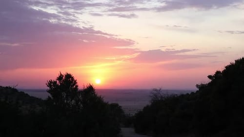 Time lapse of a early morning orange sunrise