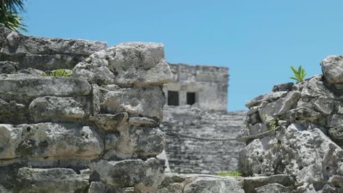 4K Cinematic landscape nature footage of the Mayan ruins of Tulum in Quintana Roo, Mexico on a sunny
