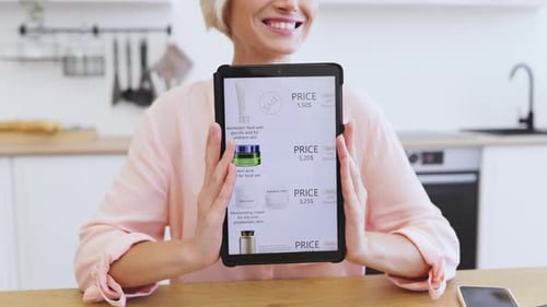 Happy Woman Showcasing Online Cosmetics Shopping on Tablet