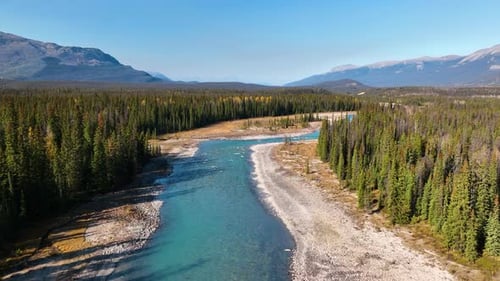 Canada. A drone view of the river in the mountains valley. An aerial view of river. Winding river.