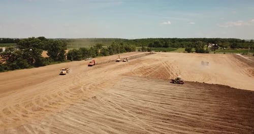 Aerial View of Construction Equipment Leveling Land