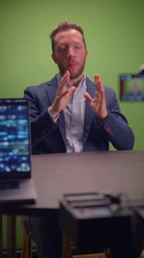 A Professional Speaker Engaging the Audience Effectively in a Green Screen Studio Setting
