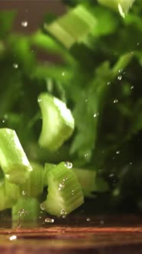 Pieces of Chopped Celery Fall on the Table Filmed on a Highspeed Camera at 1000 Fps