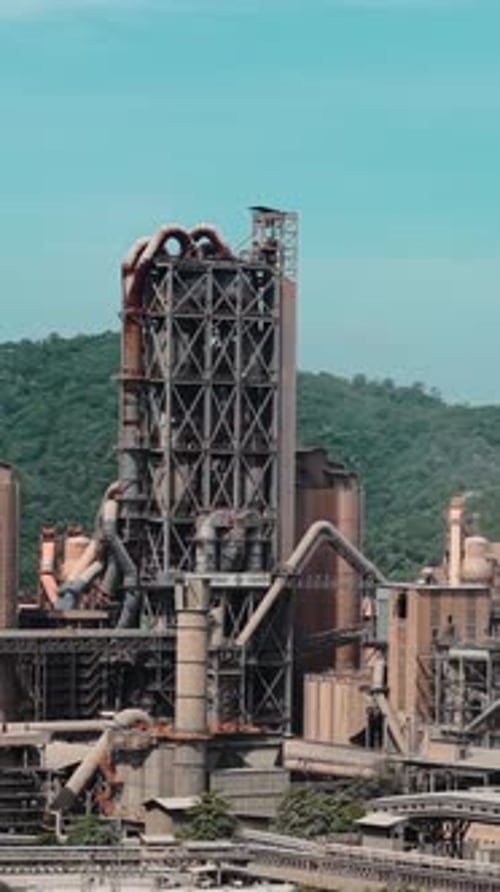 Industrial Cement Factory Plant Against Hills