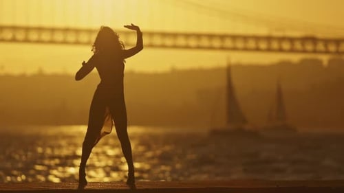 Woman Dancing Silhouette at Sunset