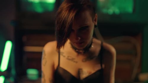 Sexy Lady Looking at Camera and Posing in Studio Tattoos on Female Body Beautiful Young Woman in