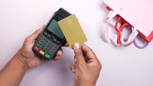 Contactless Payment Concept with Young Man Paying with Credit Card