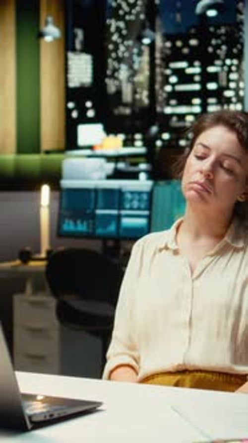 Vertical Video Entrepreneur Contemplating on a Complex Problem in a Dark Office Late at Night