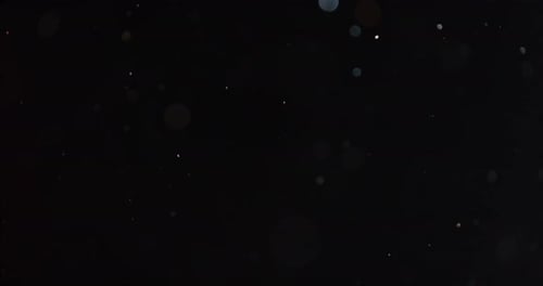 Abstract White Particles Floating on a Dark Background
