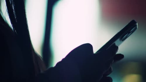 Isolated Girl Receiving a Text on her Phone