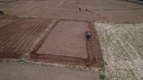 Top view of walking tractor is plowing for weed control and farming.