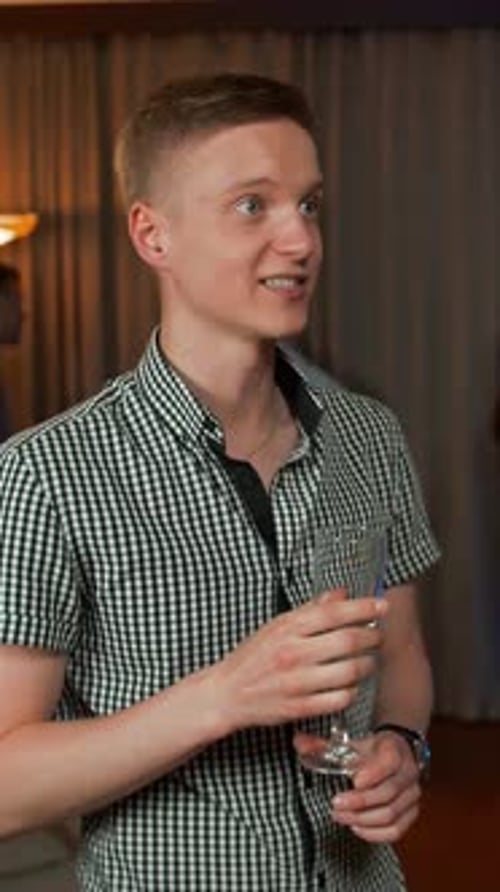 Smiling Man Talks at Fun Party