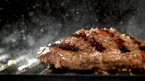 Beef Burger is Fried in a Grill Pan Filmed on a Highspeed Camera at 1000 Fps