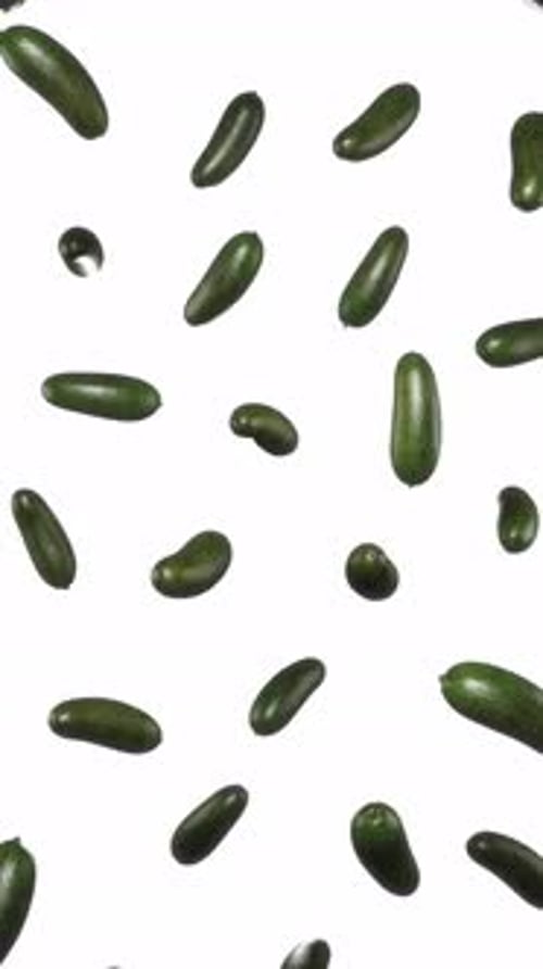 Animated Falling Green Produce on White Background