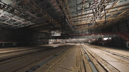 Large Industrial Warehouse Interior with Overhead Structures and Lighting