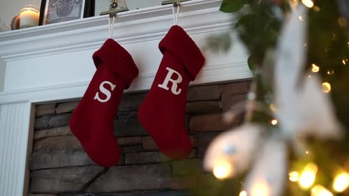 Christmas stocking hanging above the fireplace for Santa Claus to fill - sliding view with the decor