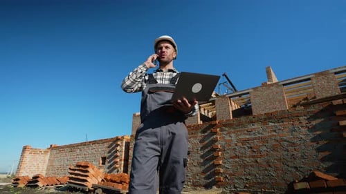 Construction Foreman Giving Instructions Over the Phone