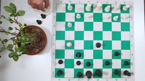 Top View Of Strategic Capturing Moves In A Chess Game. overhead