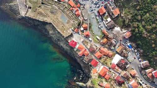 Settlement Built On A Hillside By The Sea