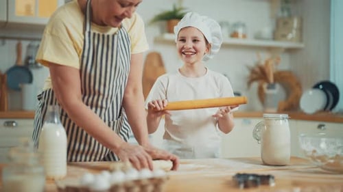 Grandmother and Child Baking Together in Kitchen