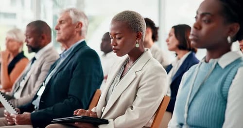 Business, seminar and woman in audience with tablet, typing notes and information from workshop