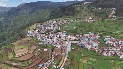 Rural charm of Kodaikanal captured through a slow aerial drone rise.