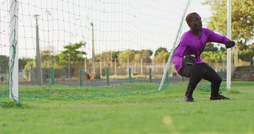 Video of african american football male goalkeeper with ball
