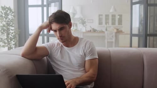 Focused Businessman Using Laptop Computer At Home Office. Closeup Serious Man Working Computer At...