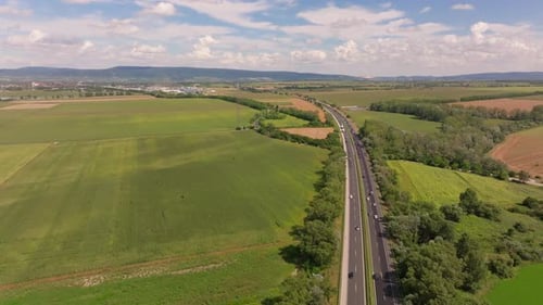 Aerial View of Highway Through Green Rural Landscape