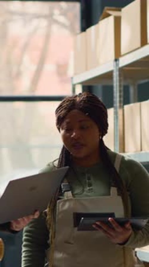 Vertical Video Employees Check Warehouse Inventory