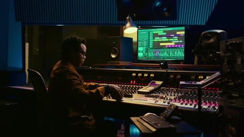 African American Sound Designer Removing Tonal Imbalances and White Noise
