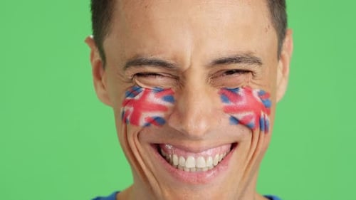 Smiling Man with Union Jack Face Paint