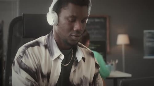 Programmer Working on Laptop and PC in IT Company Office