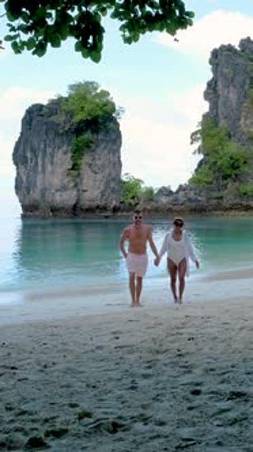 Couple Men and Women on a Tropical White Beach in Thailand Koh Hong Island Krabi