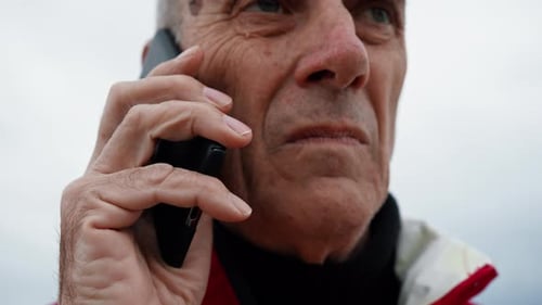 Senior Adult Talking on Cellphone in Extreme Close Up