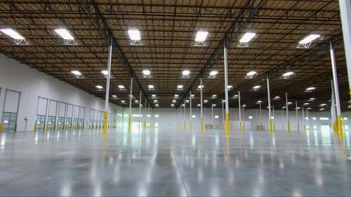 Internal moving shot inside a new warehouse ready for new tenants.